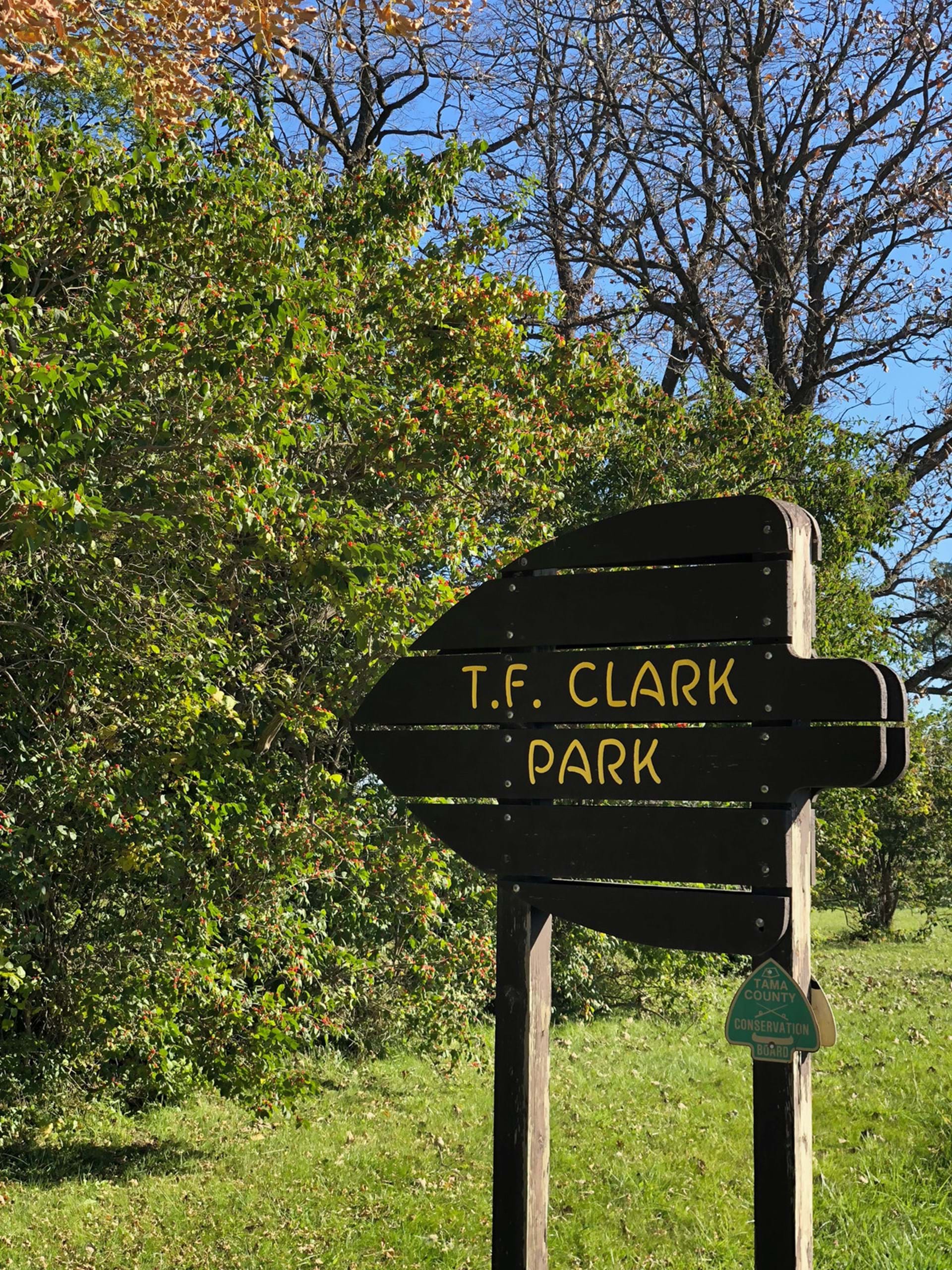 A rustic sign marks the park's entrance.