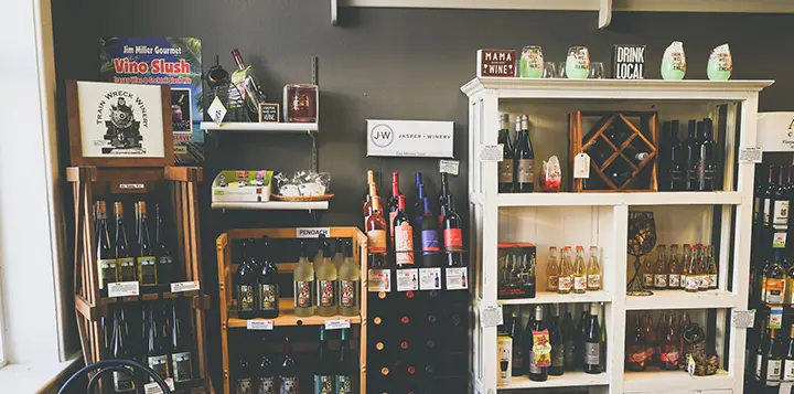 A look inside The Wijn House with multiple displays of wine for sale