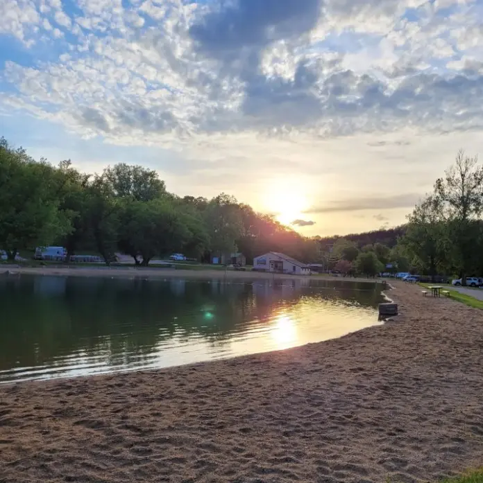 An early sunset looms above a campground beach. 