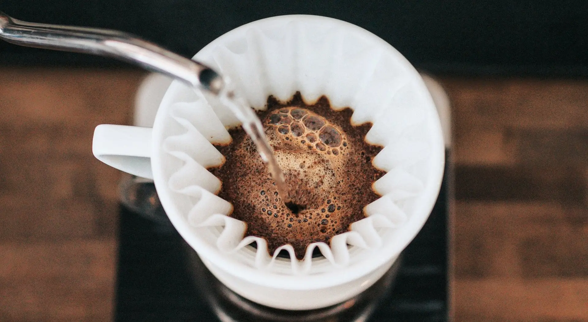 A coffee cup with a paper filter. 