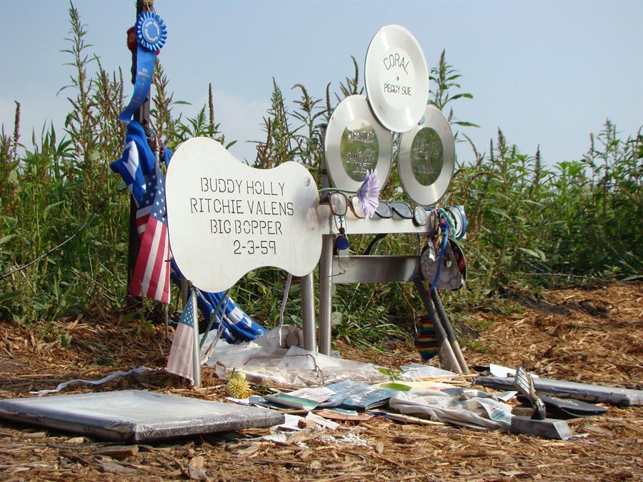 An inscribed guitar and three records mark the location that the plane came to rest.