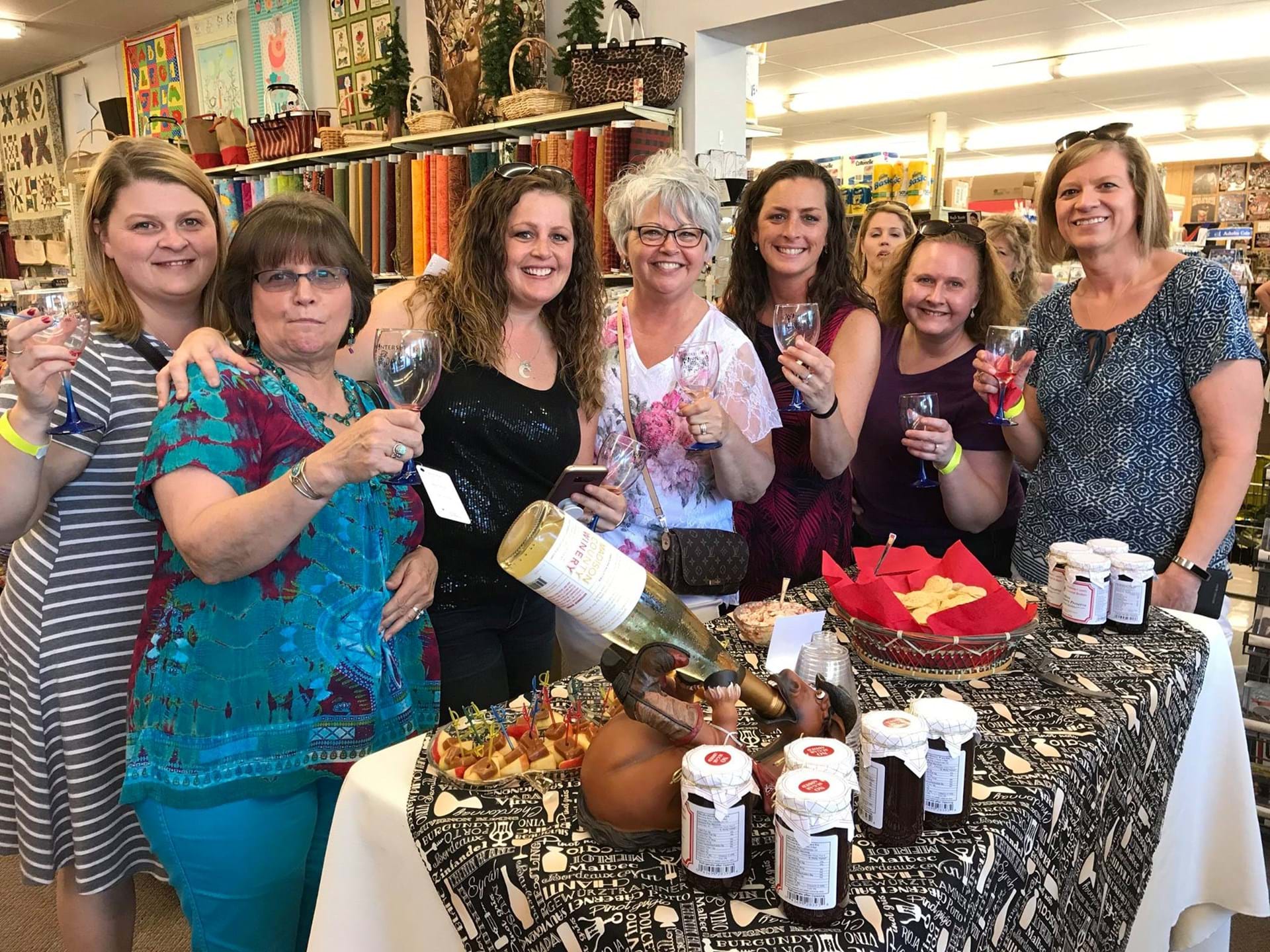 A group of women enjoy the Winterset Wine Walk at Ben Franklin