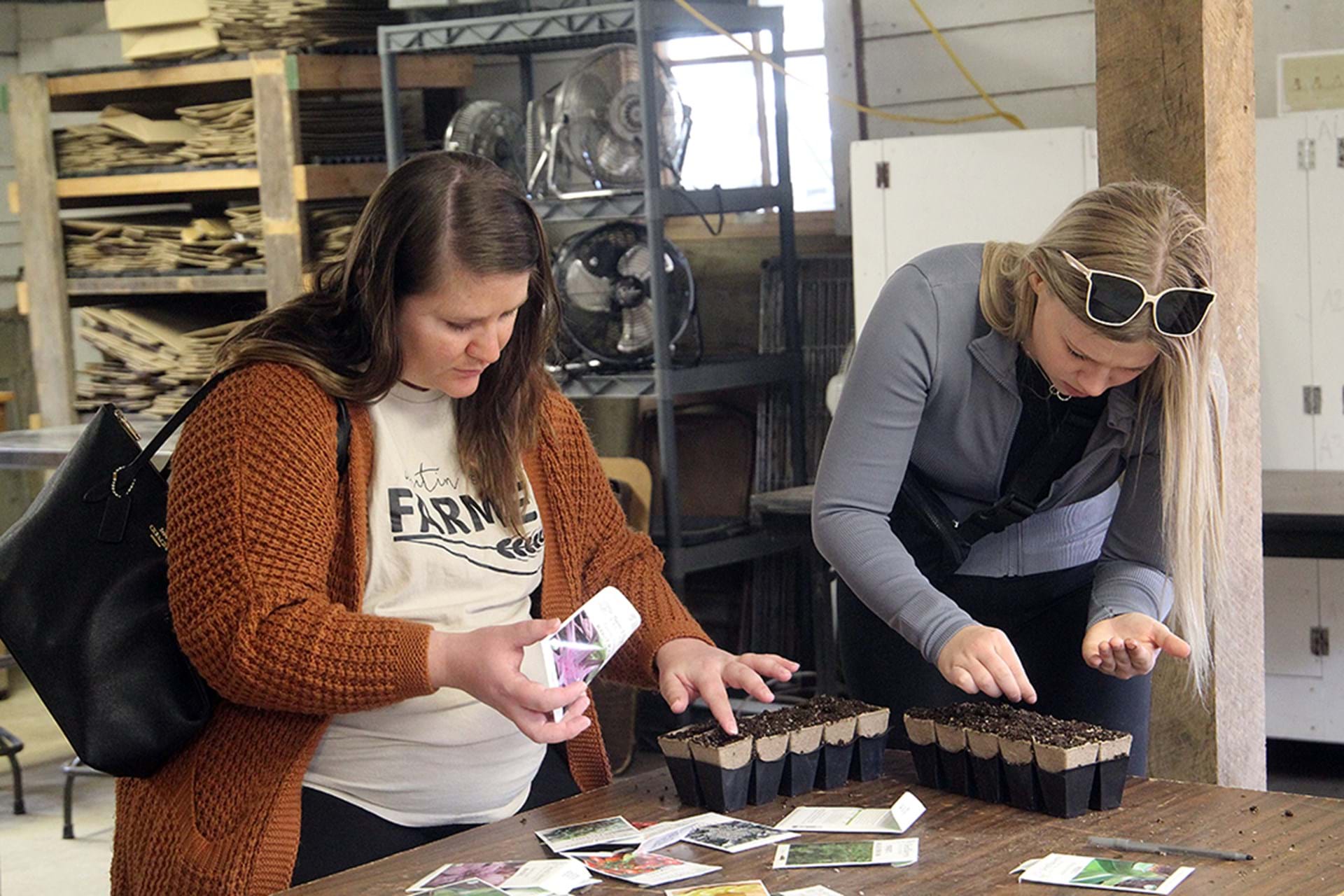 Workshop attendees planting their seeds.