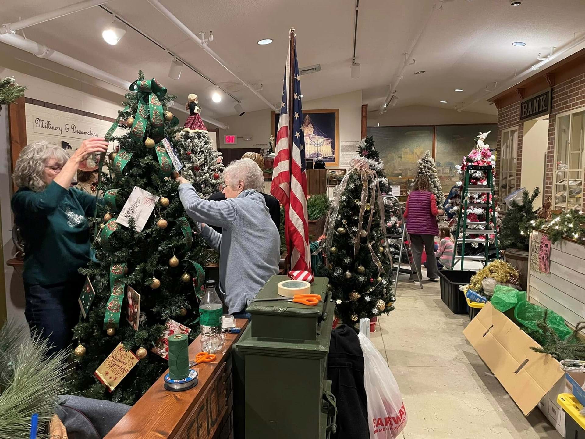 Our volunteers are hard at work decorating each unique tree.