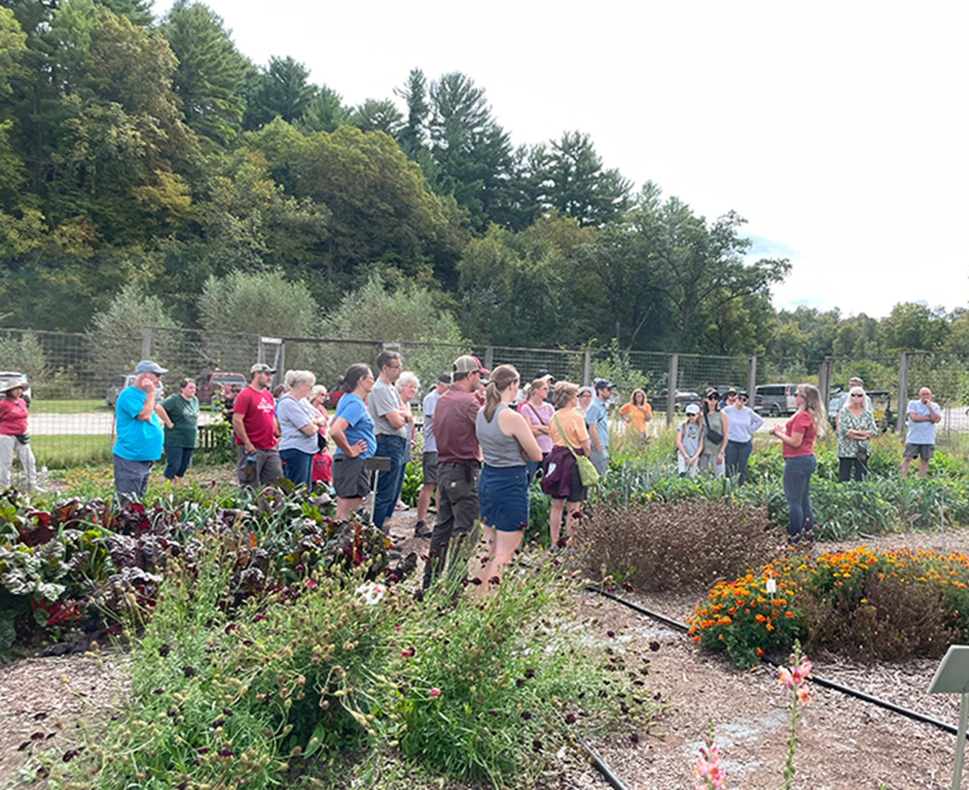 Tour group in the evaluation garden at Heritage Farm.