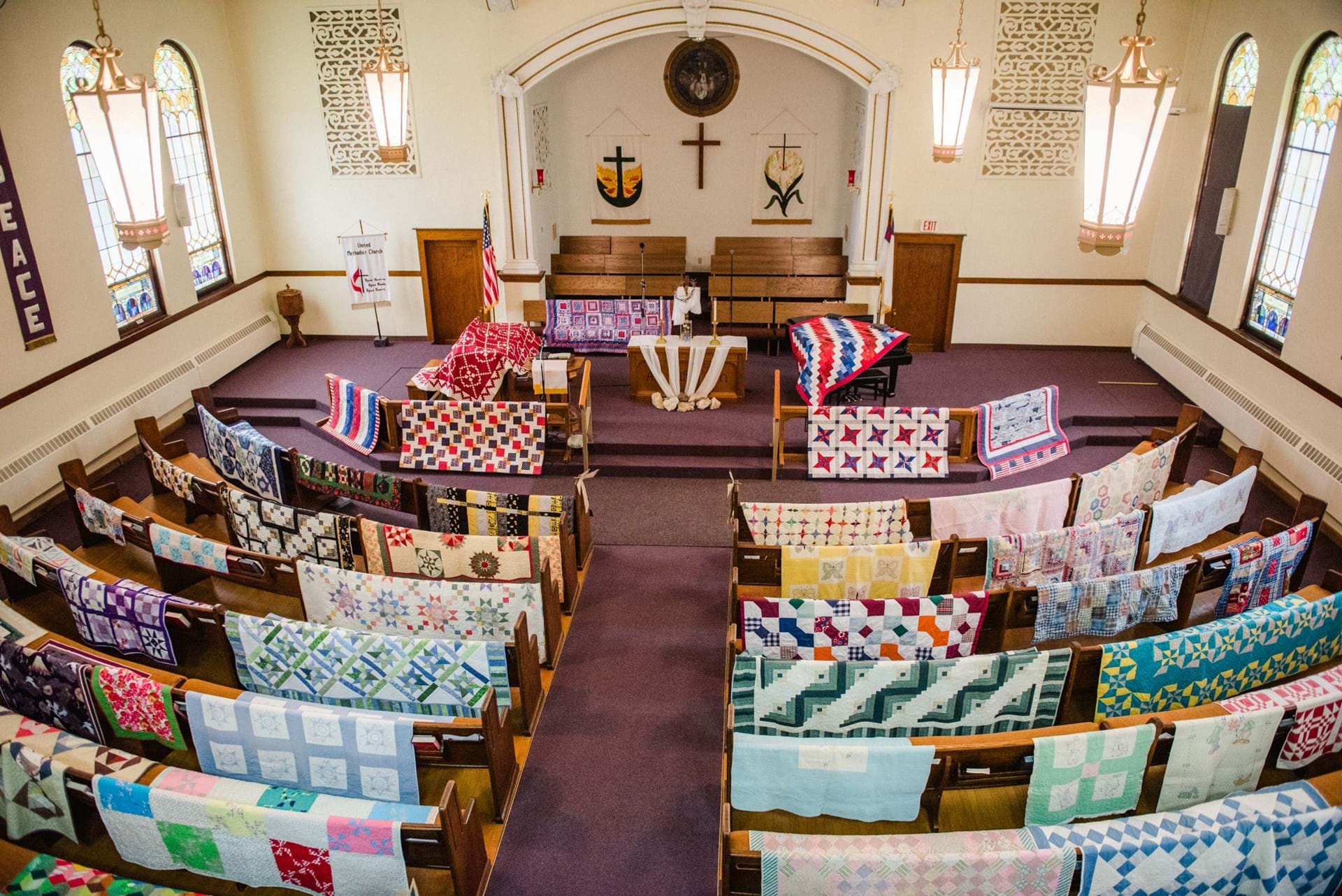 Quilts displayed at a church in Winterset