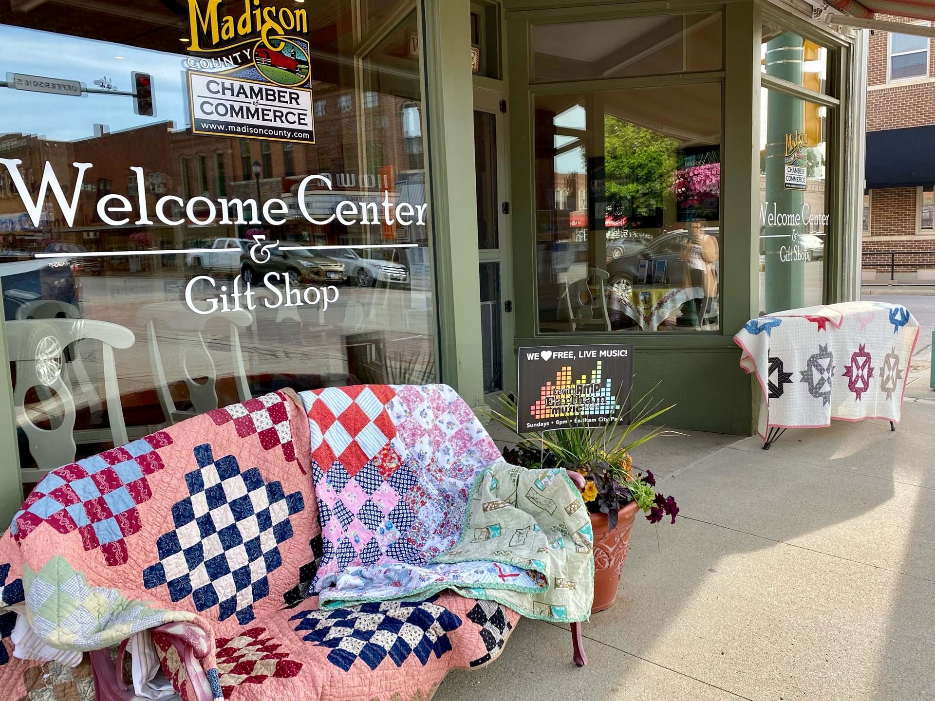 Quilts draped in front of the welcome center
