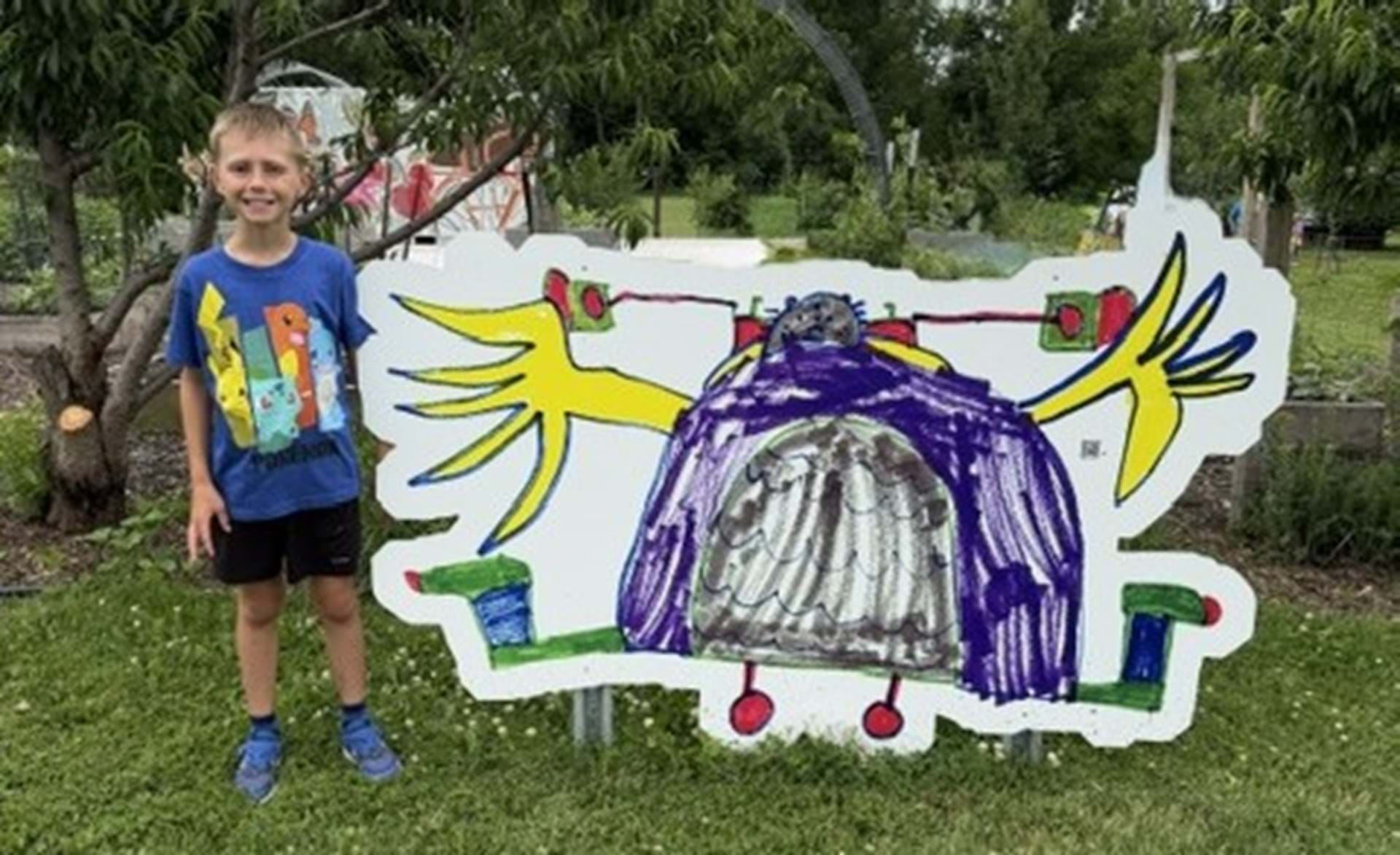 Youth artist with his Creature