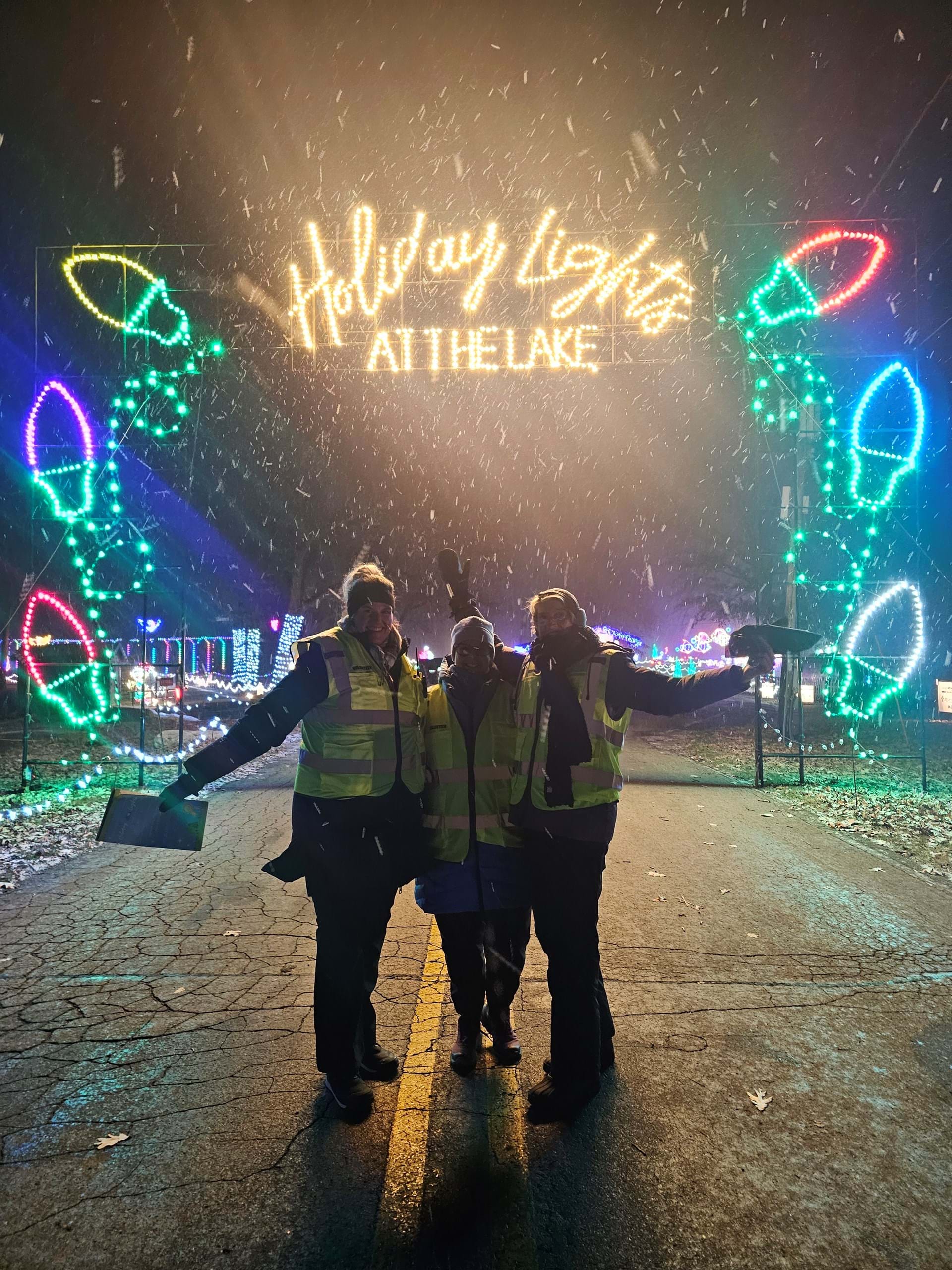 Volunteers Greet Guests at the Holiday Lights at the Lake Entrance