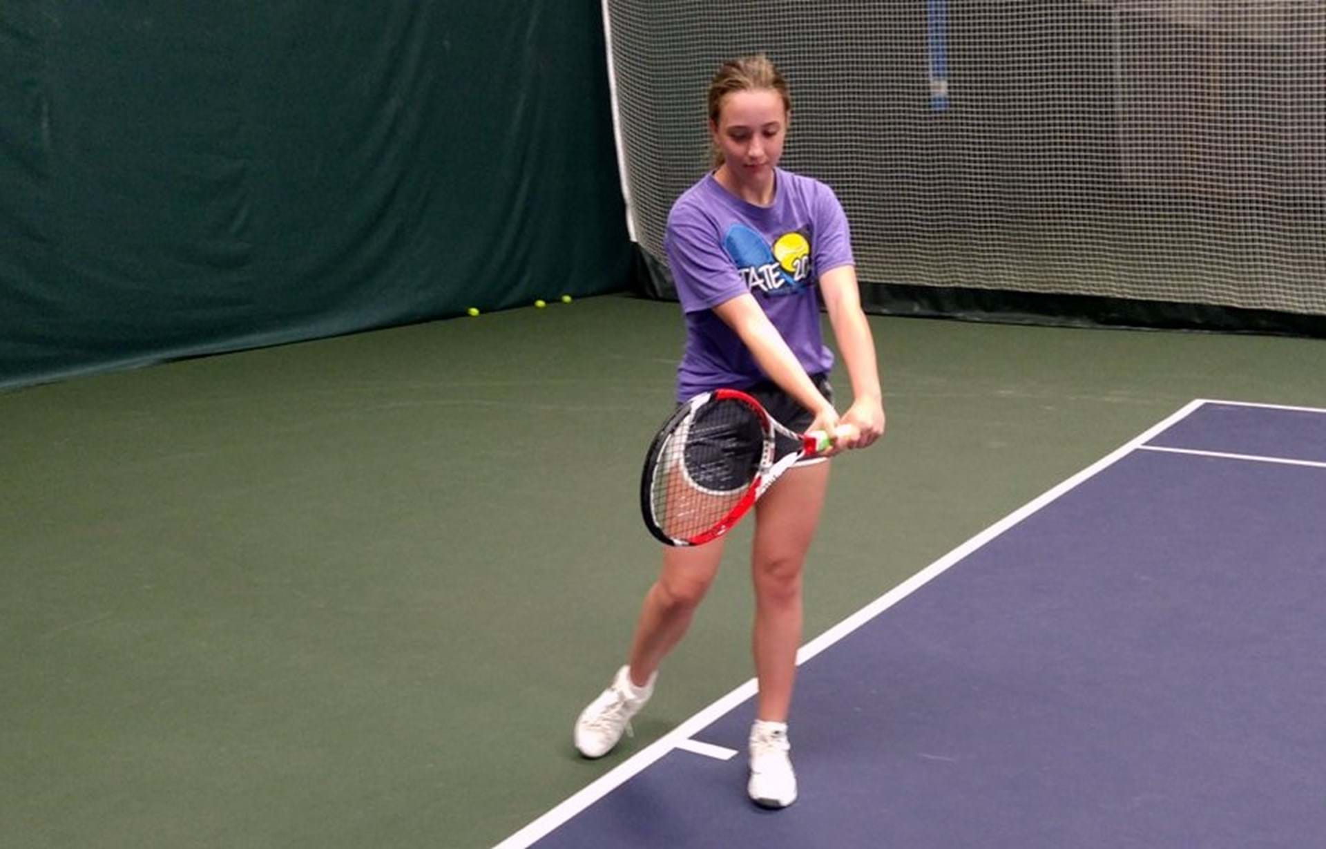 Macy Baker of Red Oak, IA practicing a swing.