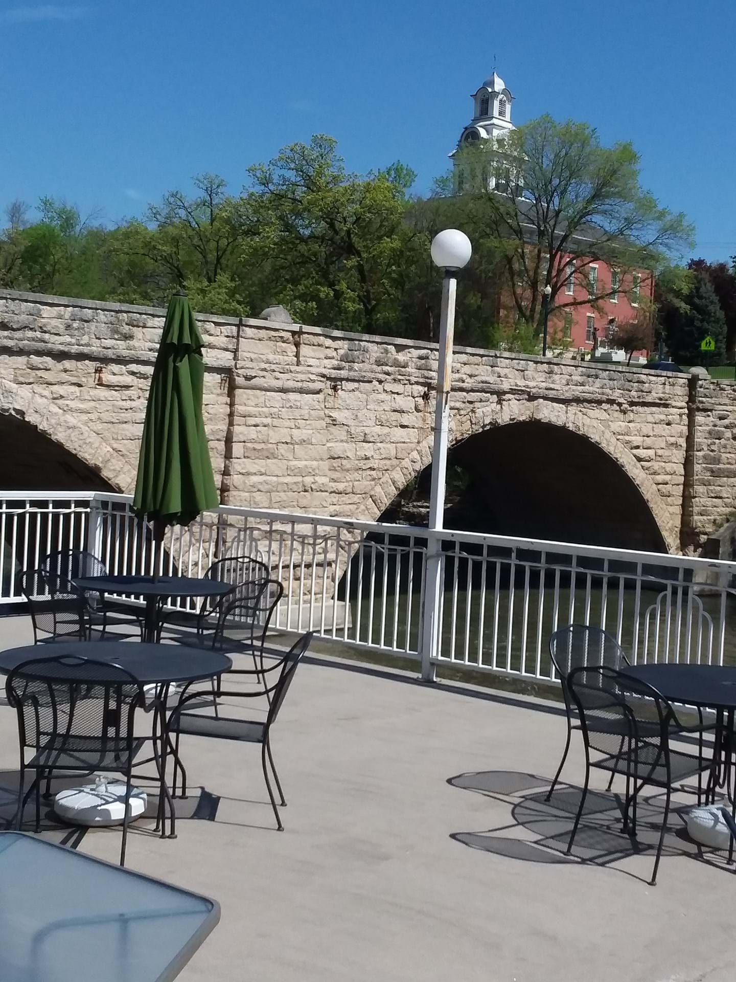 Open seasonally, our large patio overlooks the Turkey River and Elkader's historic Keystone Bridge.