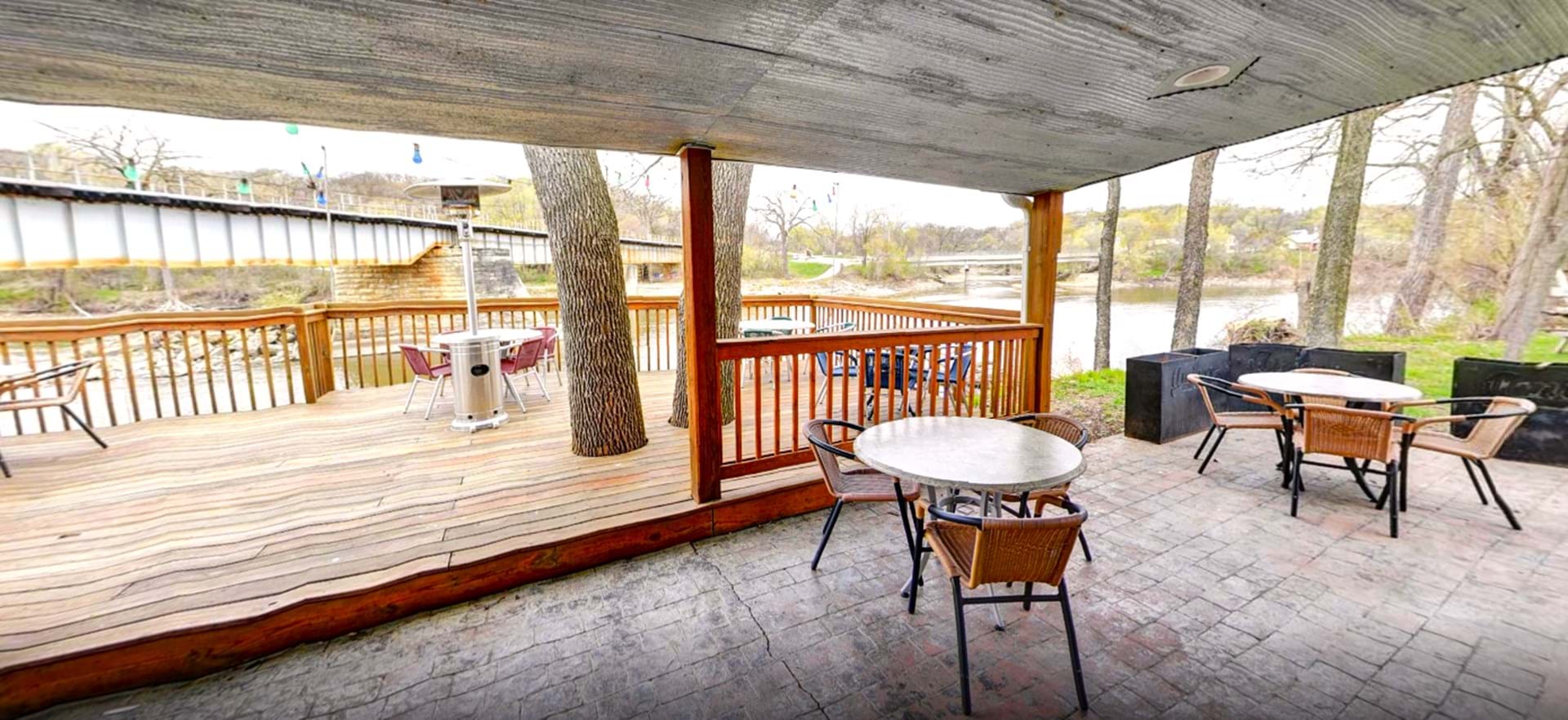Patio and deck seating with views of the river give a casual, relaxing vibe.