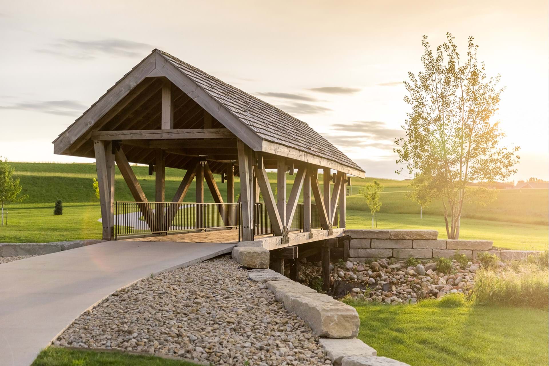 Enjoy a wooden pedestrian bridge near Bridgeview Pond.