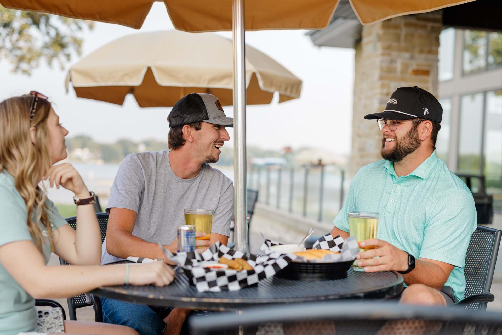 Golfers enjoy drinks and appetizers after a round