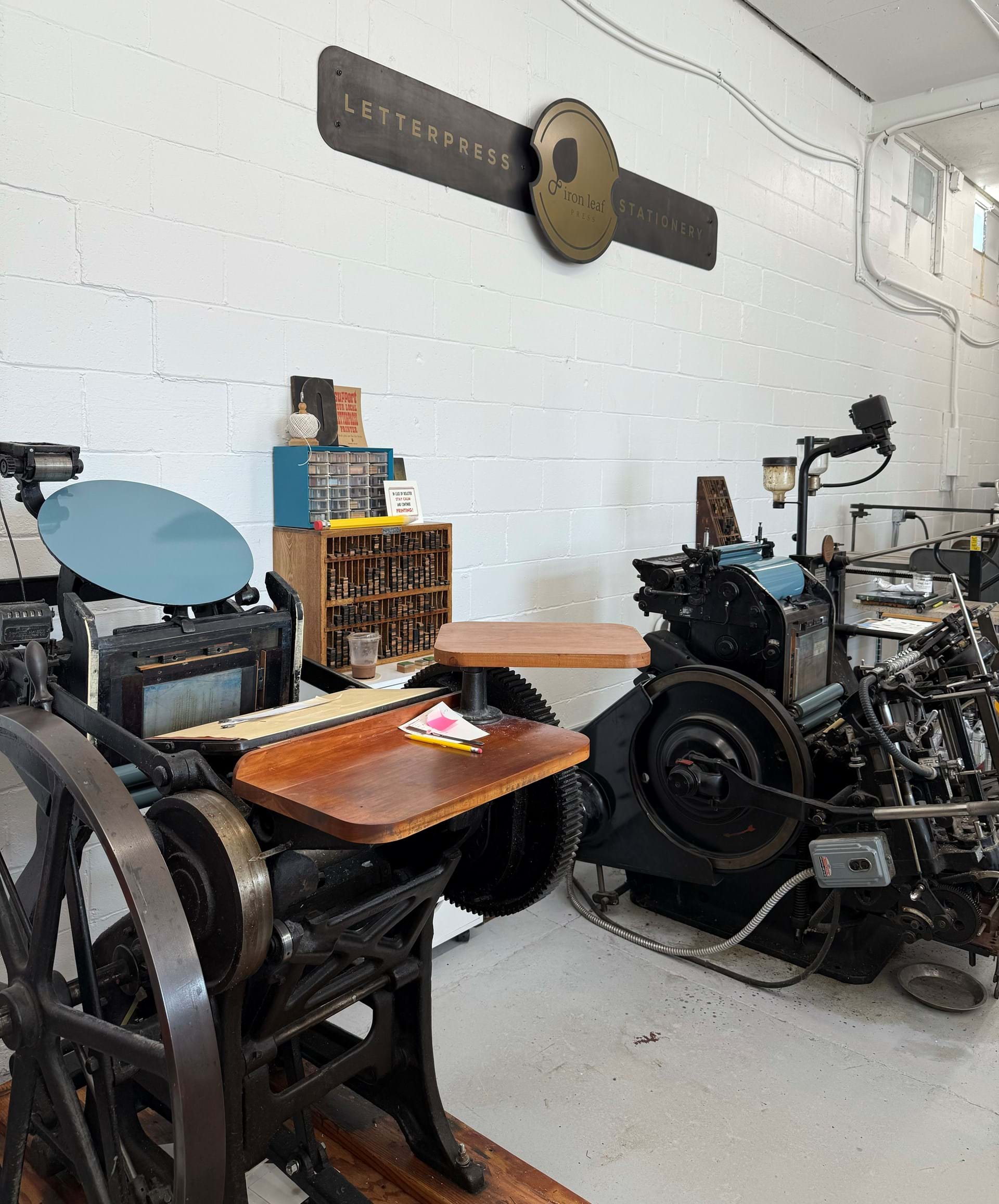 Two of our antique printing presses, dating to 1919 and 1954.