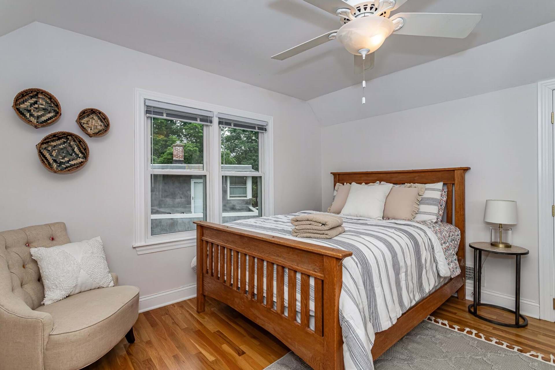Comfortable guest bedroom with fresh linens, ready for your Iowa stay
