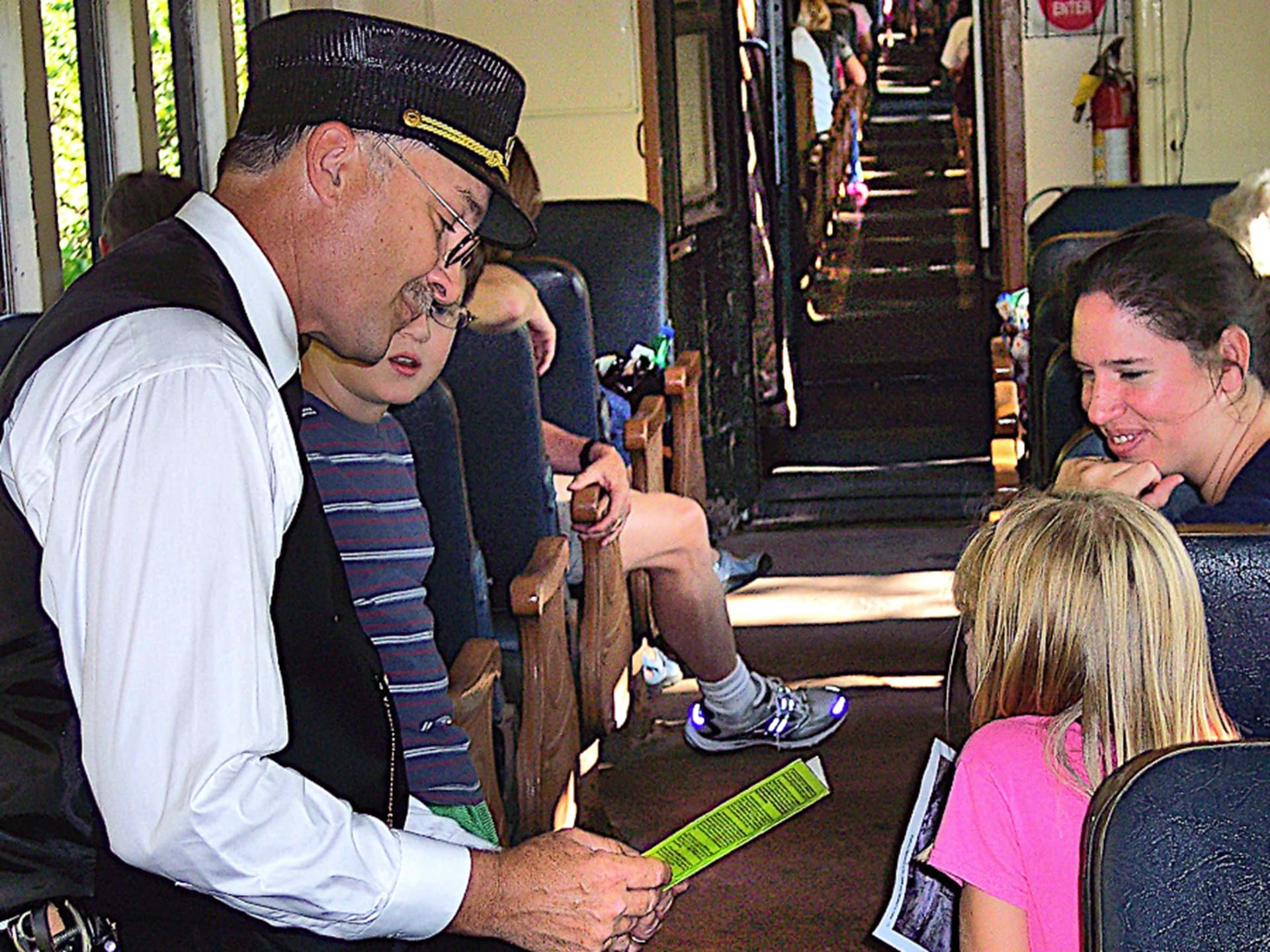 The Fraser Train conductor stops to chat with passengers