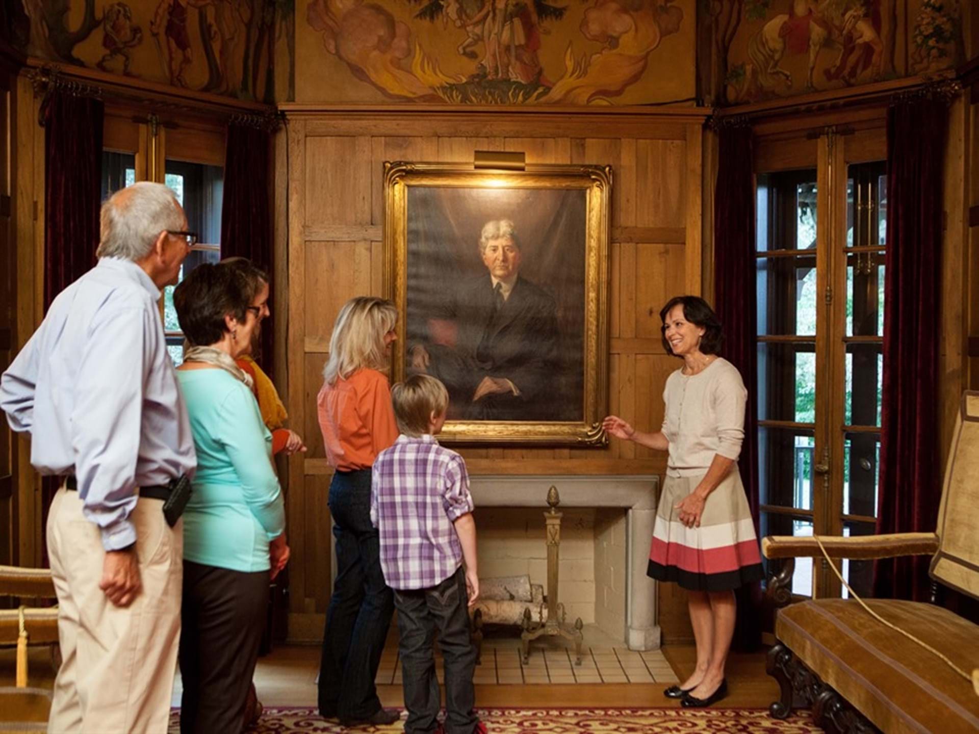 Guests enjoying a guided tour of the Brucemore mansion