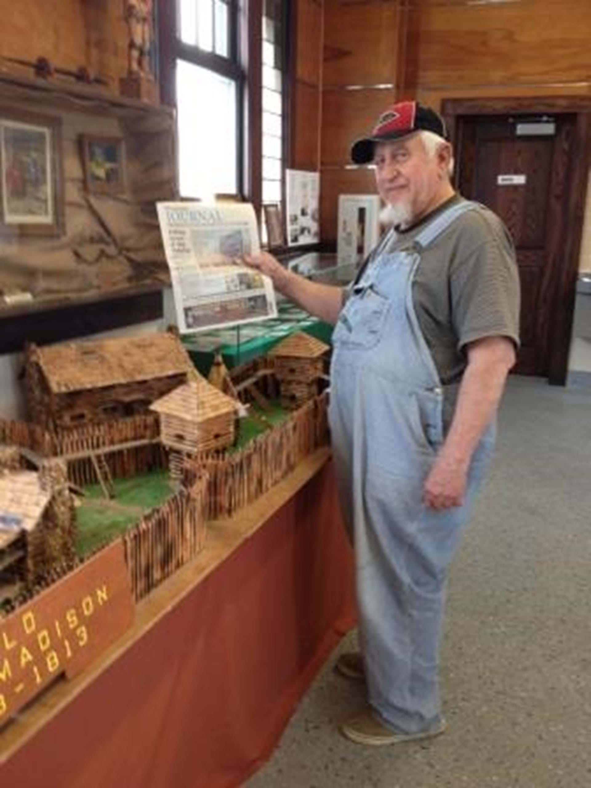 Docent Andy Andrews in Museum Main Showroom with Fort Replica