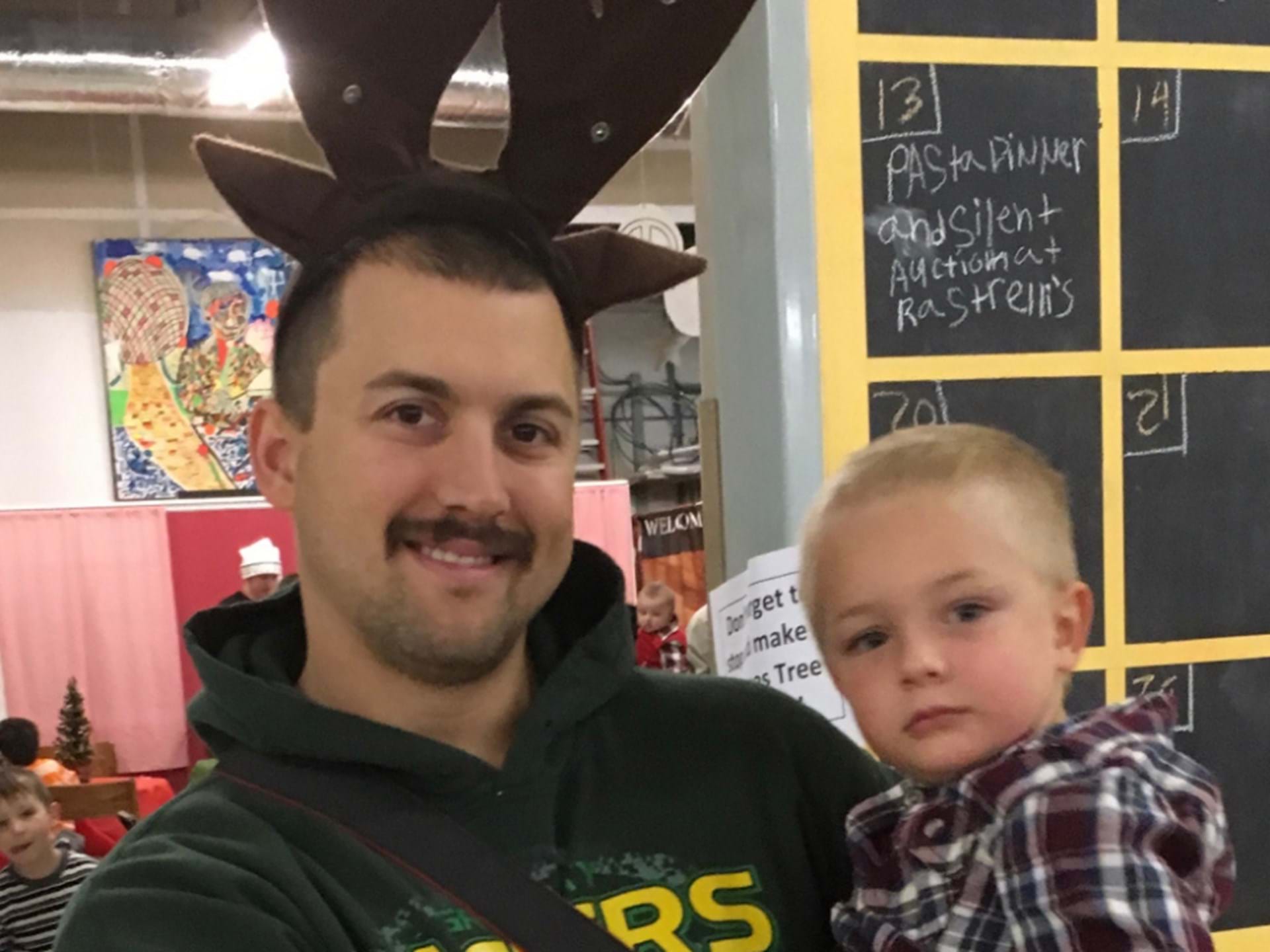 Dad and Son enjoy Milk & Cookies with Santa