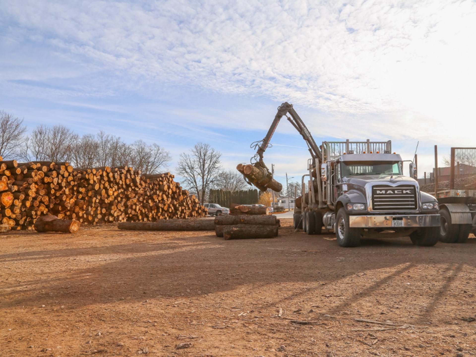 Unloading logs. - Kendrick Forest Products, a division of Kendrick, Inc.