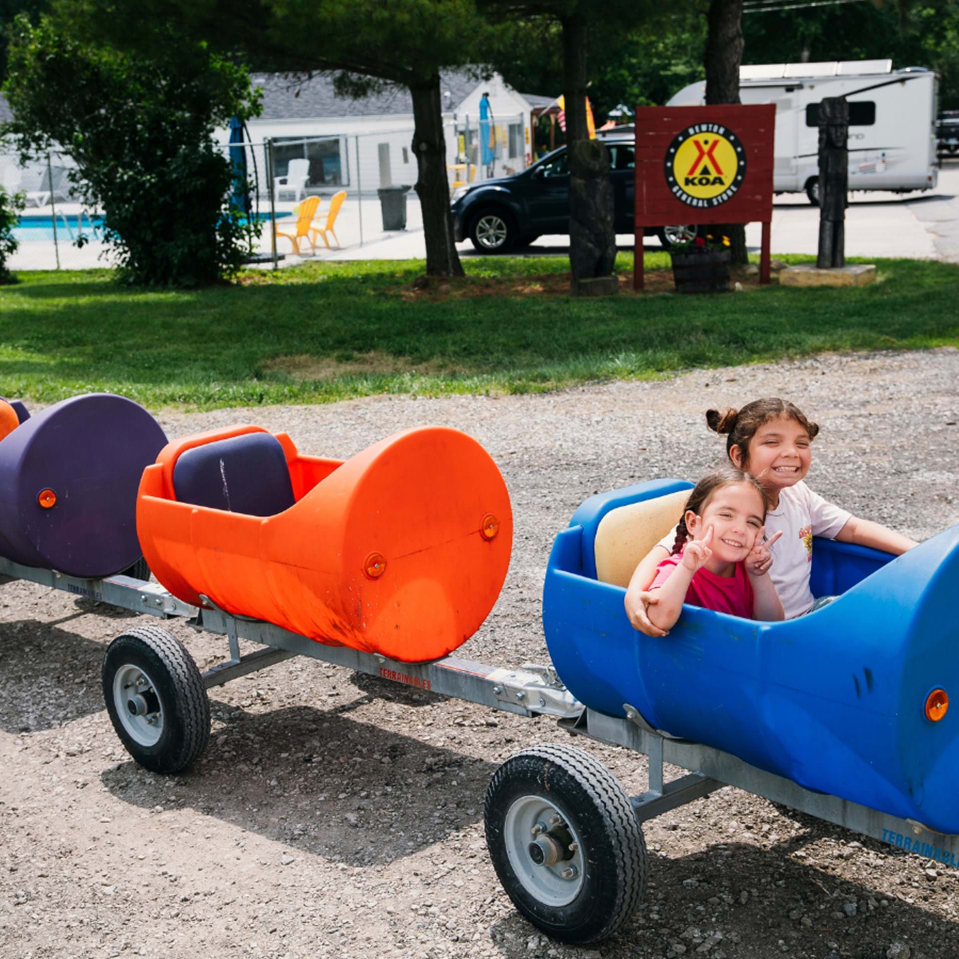All aboard the KOA Kiddie Train, where little conductors embark on fun-filled adventures and laughter circles every track.